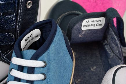 Stick shoe labels onto the side wall or beneath the tongue